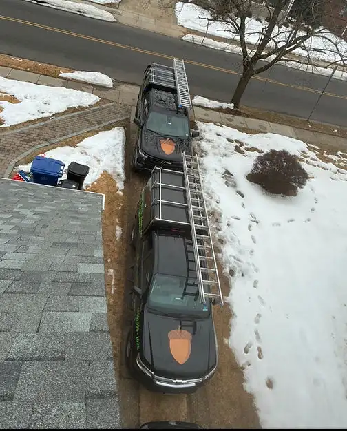 The Acorn truck and ladder set up for a rooftop chimney cap install